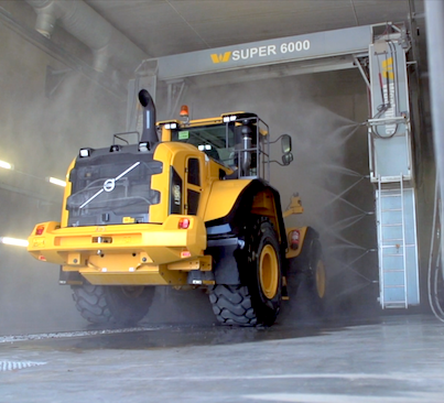 Tractor being washed in a touchless wash system.
